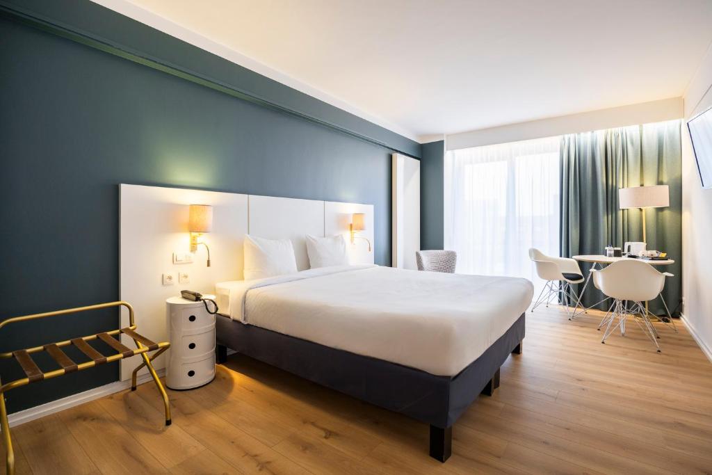 Postel nebo postele na pokoji v ubytování Hotel Louise