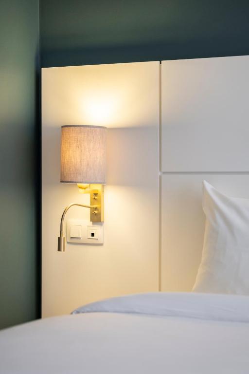 Postel nebo postele na pokoji v ubytování Hotel Louise