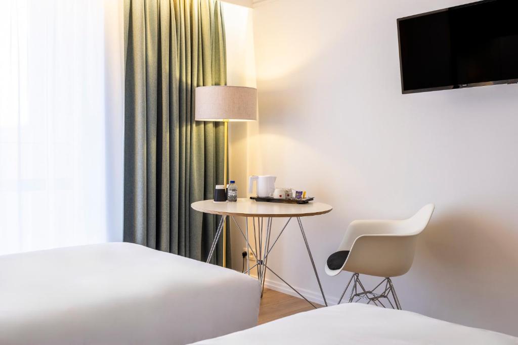 Postel nebo postele na pokoji v ubytování Hotel Louise