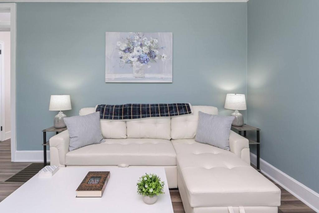 a living room with a white couch and a table at Hollywood Hideaway - 1BR 1BA in Columbia