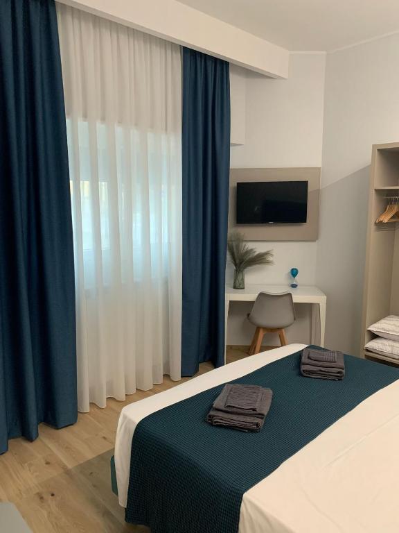 Postel nebo postele na pokoji v ubytování Fla Rooms