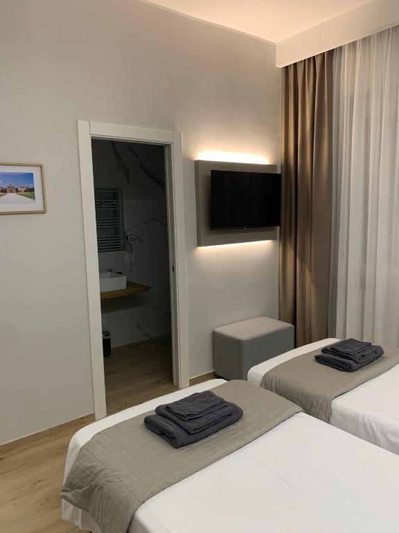 Postel nebo postele na pokoji v ubytování Fla Rooms