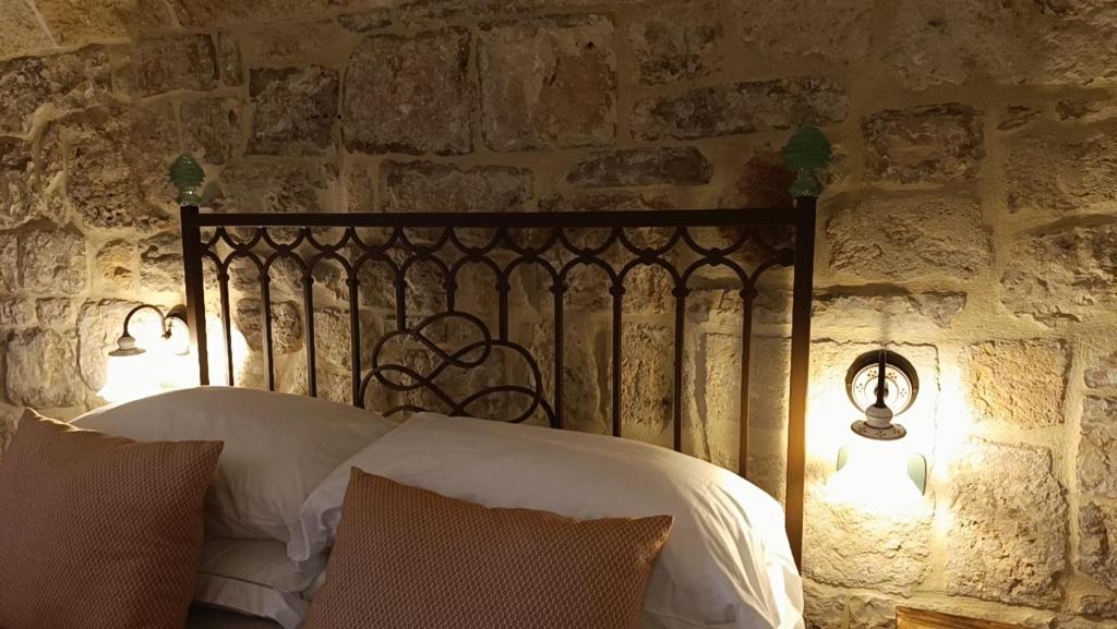 Postel nebo postele na pokoji v ubytování Trame Poesia di mare 2