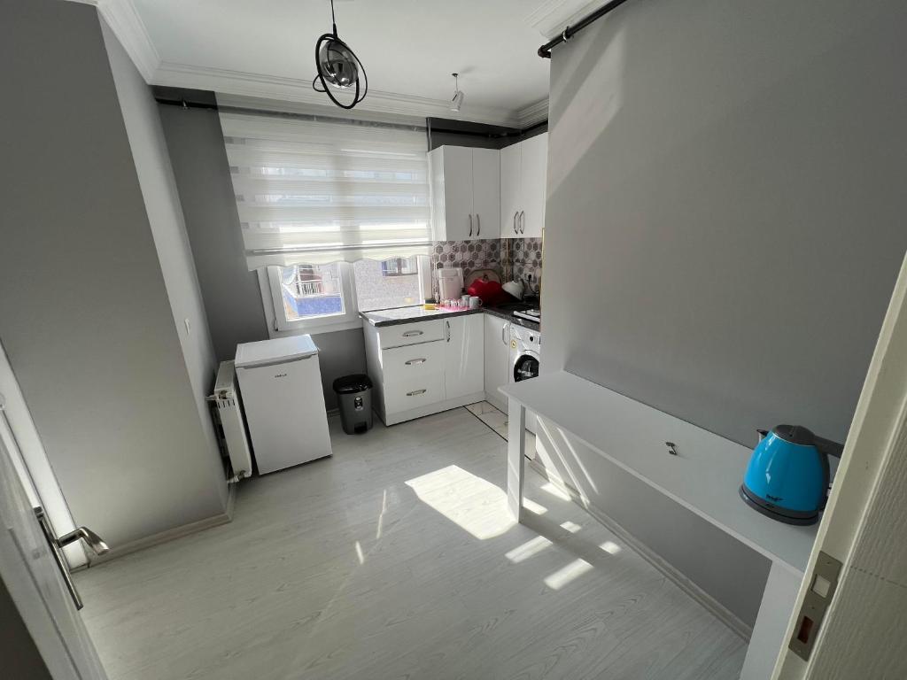 Kuchyň nebo kuchyňský kout v ubytování NOKTA SUITE APART