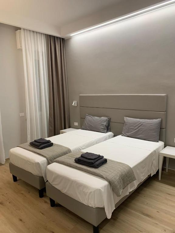 Postel nebo postele na pokoji v ubytování Fla Rooms