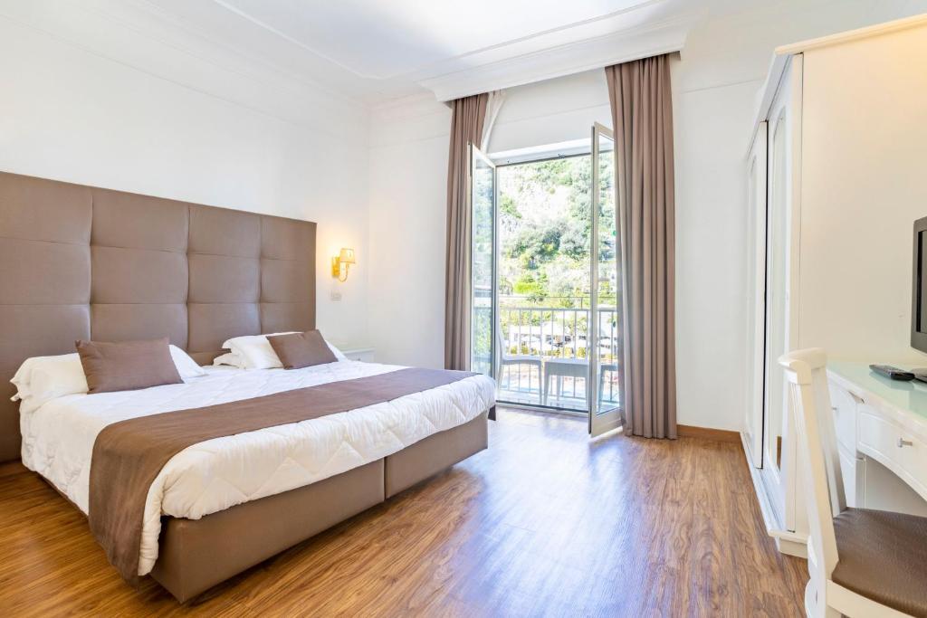 Postel nebo postele na pokoji v ubytování Grand Hotel Parco del Sole - All Inclusive