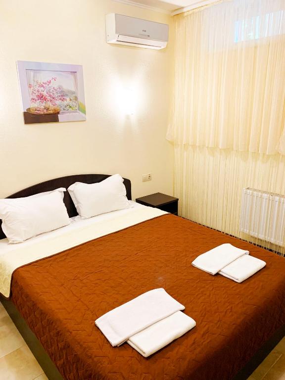 Postel nebo postele na pokoji v ubytování Breeze Hotel