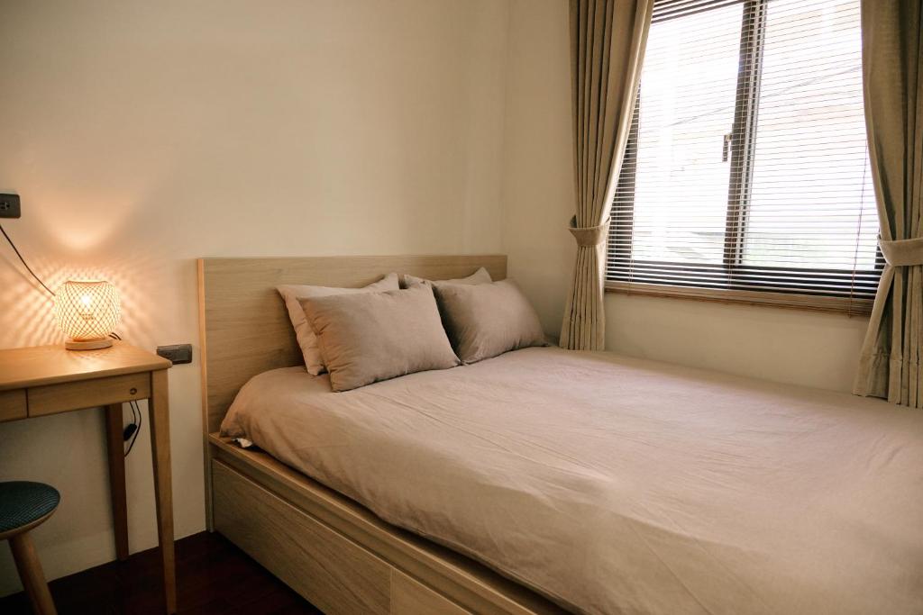 Postel nebo postele na pokoji v ubytování Qingyu B&B