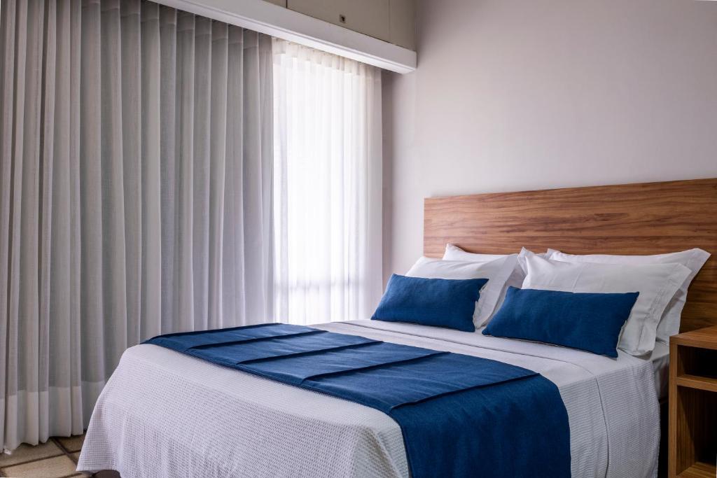 Postel nebo postele na pokoji v ubytování Fiesta Bahia Hotel
