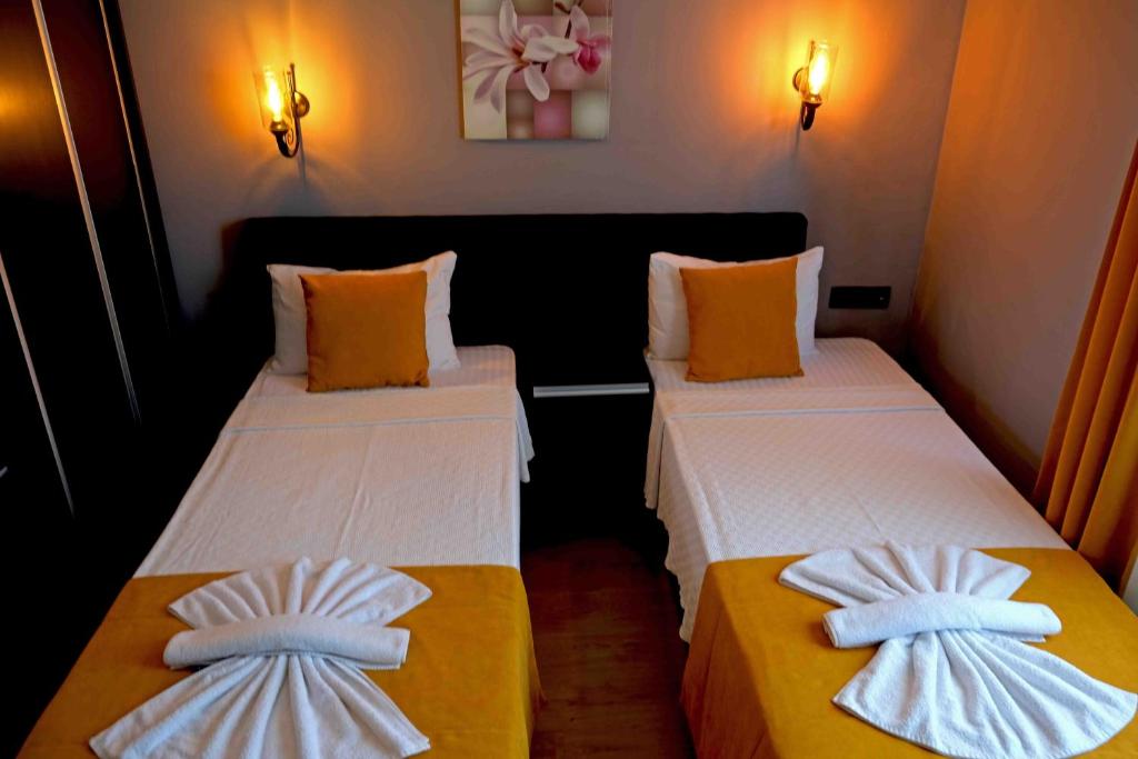 Postel nebo postele na pokoji v ubytování Yasemin Hotel