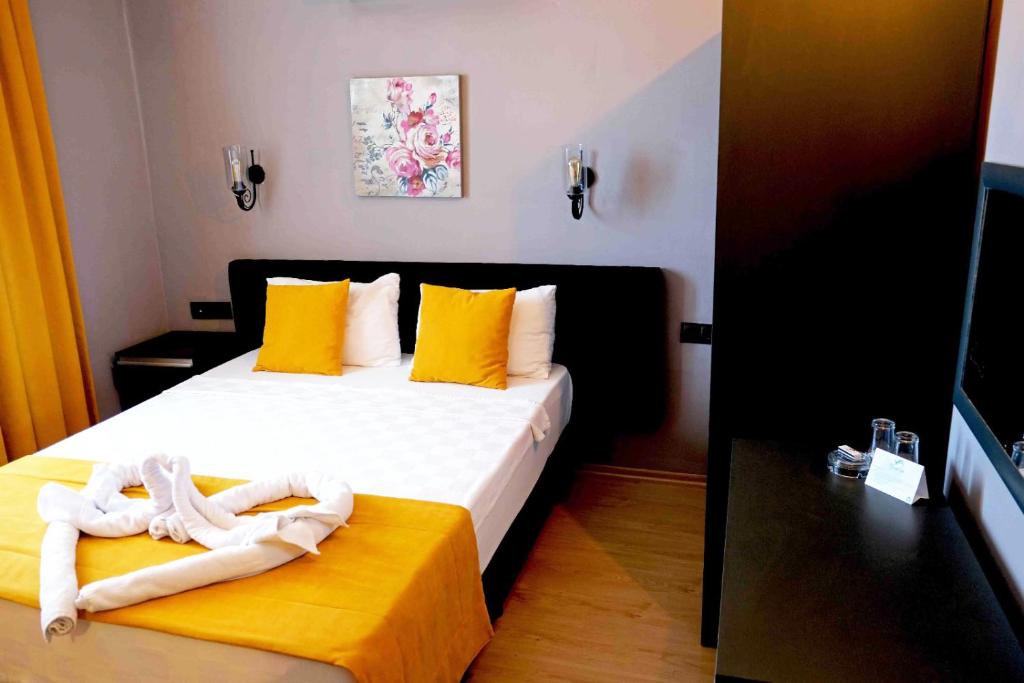 Postel nebo postele na pokoji v ubytování Yasemin Hotel