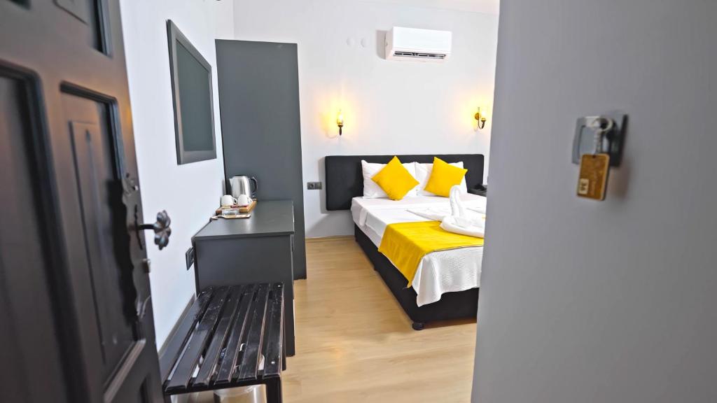 Postel nebo postele na pokoji v ubytování Yasemin Hotel