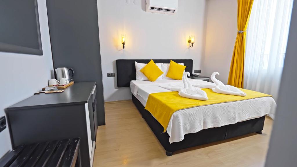 Postel nebo postele na pokoji v ubytování Yasemin Hotel