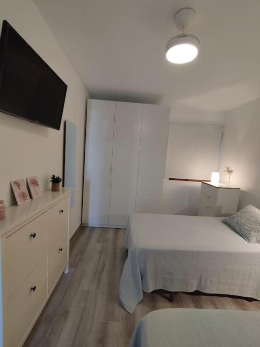 Postel nebo postele na pokoji v ubytování Flamboyán Vista Mar