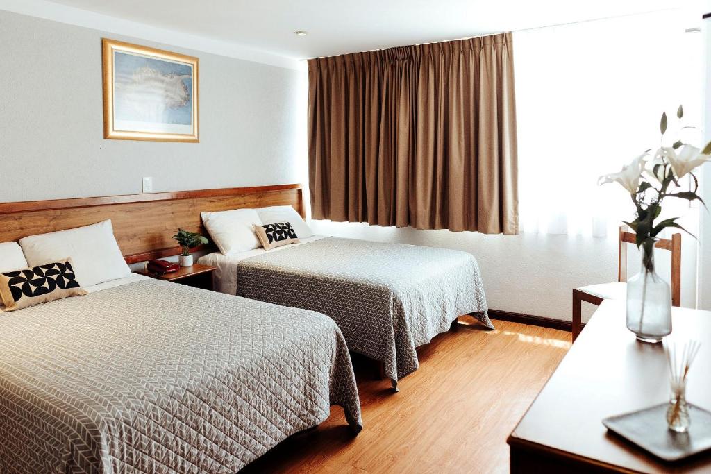 Postel nebo postele na pokoji v ubytování Hotel Don Simón