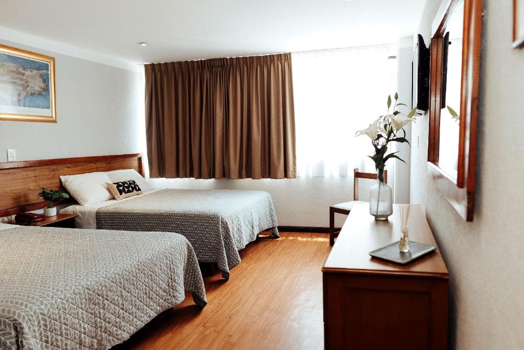 Postel nebo postele na pokoji v ubytování Hotel Don Simón