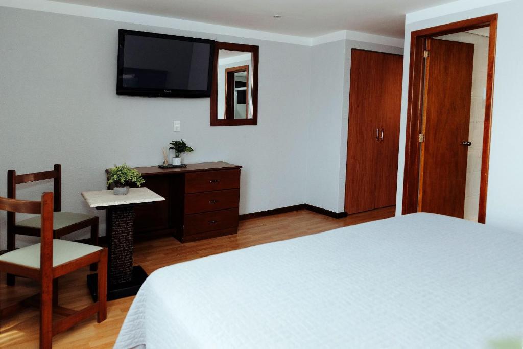 Postel nebo postele na pokoji v ubytování Hotel Don Simón