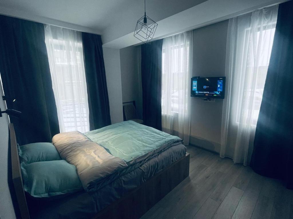 Postel nebo postele na pokoji v ubytování Crystal loft apartment 111