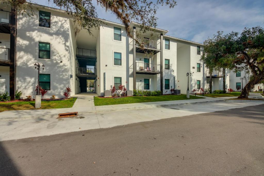 an empty street in front of an apartment building at LaBelle Apartment, Close to Parks! in La Belle