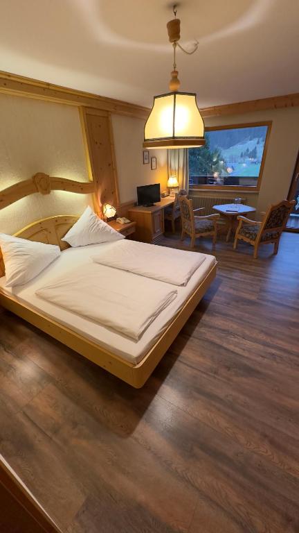 Voodi või voodid majutusasutuse Hotel Alpenrose toas