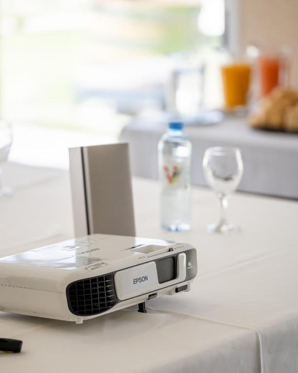 a slow cooker on a counter with a wine glass at Villa Mansa in Vistalba