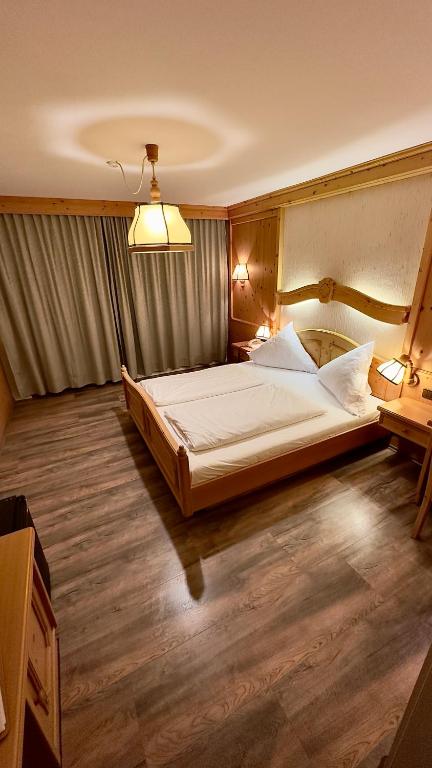 Voodi või voodid majutusasutuse Hotel Alpenrose toas