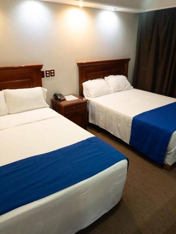 Postel nebo postele na pokoji v ubytování Hotel Real de La Barca