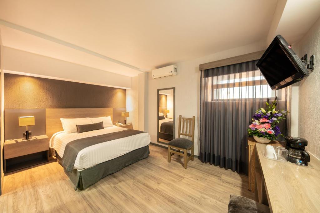 Postel nebo postele na pokoji v ubytování Hotel Malibu
