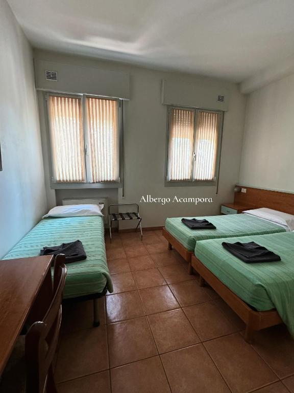 Postel nebo postele na pokoji v ubytování Albergo Acampora