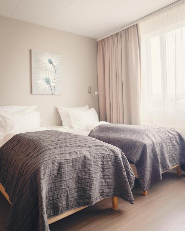 Llit o llits en una habitació de Hótel Fransiskus Stykkishólmi