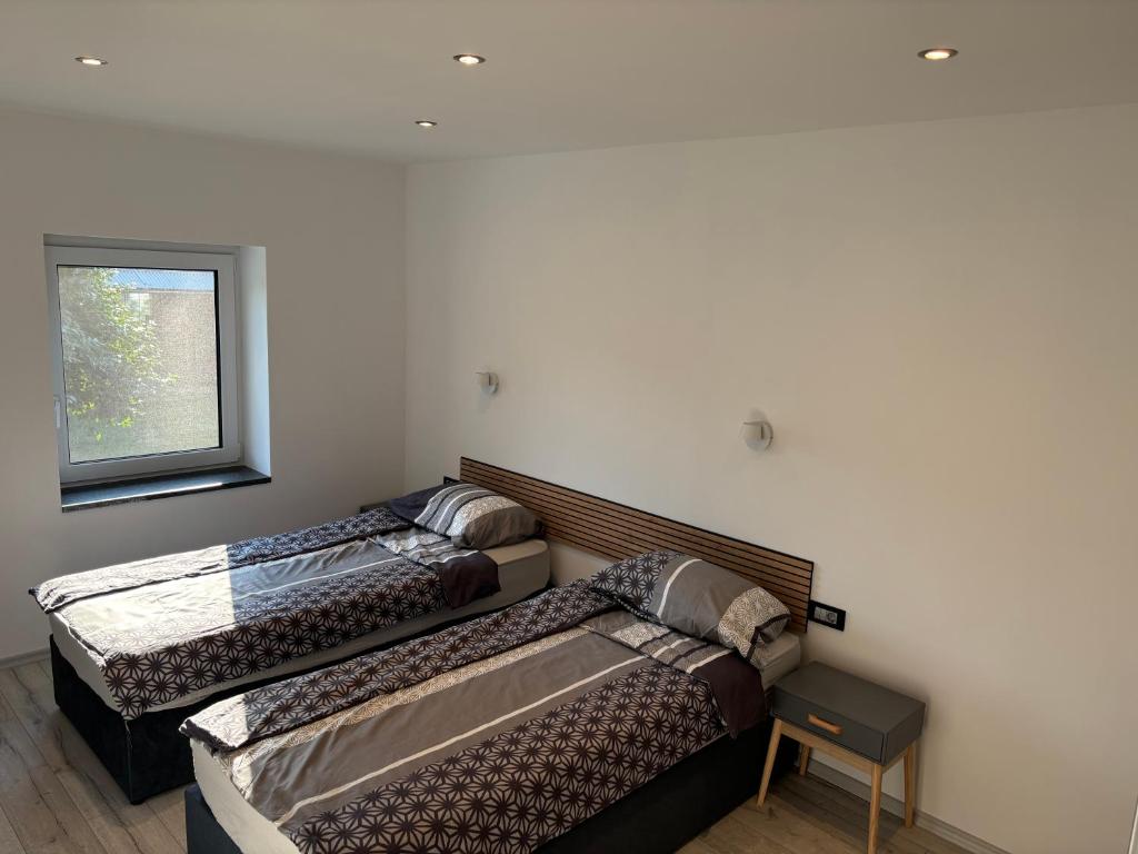 Postel nebo postele na pokoji v ubytování Livan Apartment
