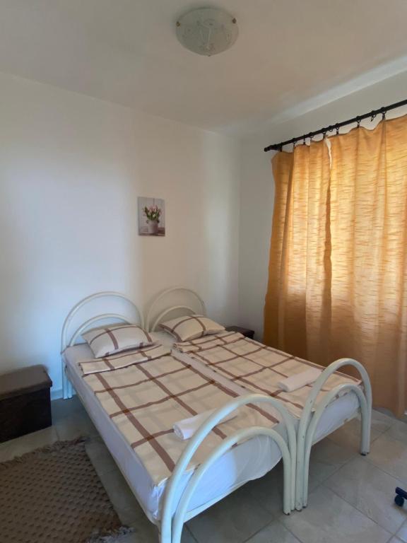 Postel nebo postele na pokoji v ubytování L & D Panorama Apartmani