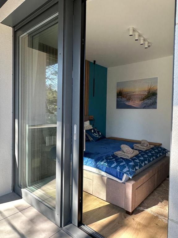 Postel nebo postele na pokoji v ubytování Hevenia Pogorzelica - Szum Morza Apartment-Sunny Side Baltic