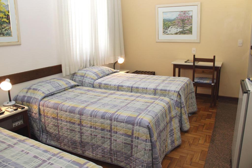 Cama ou camas em um quarto em Hotel São Bento