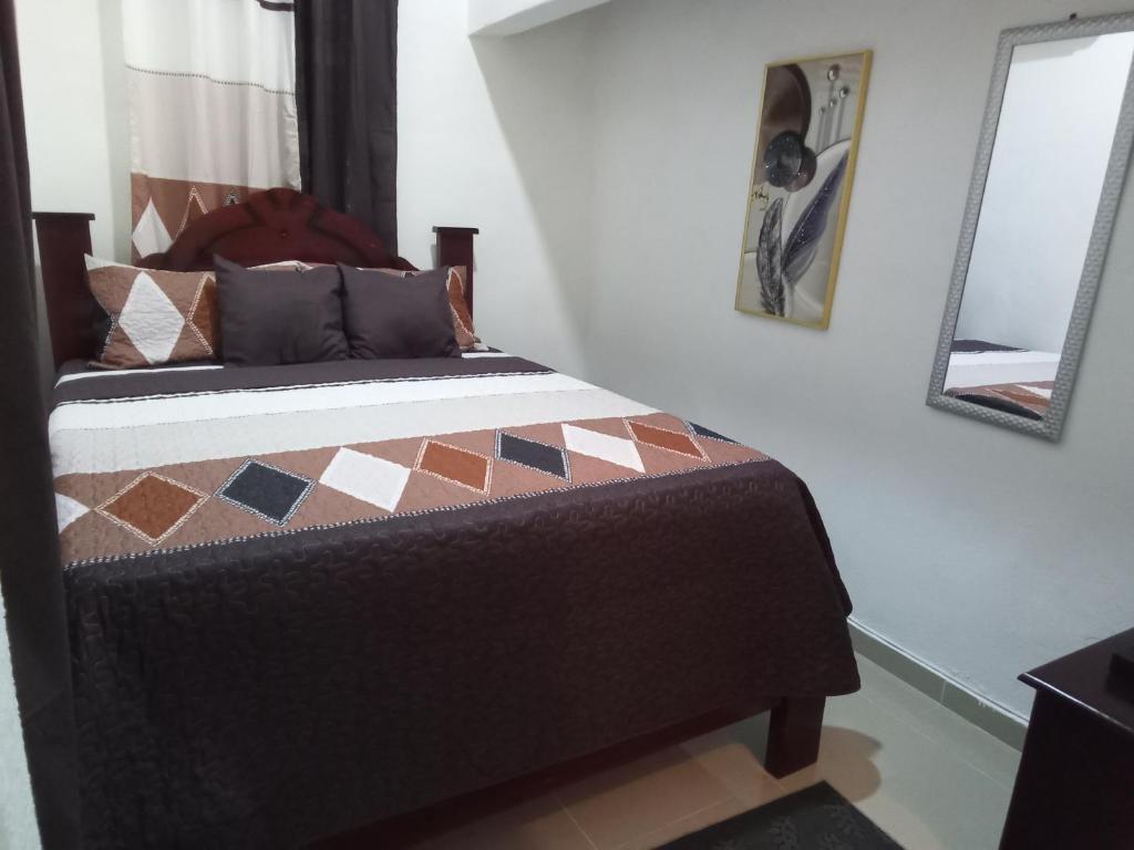 Postel nebo postele na pokoji v ubytování Hostal María Fernanda