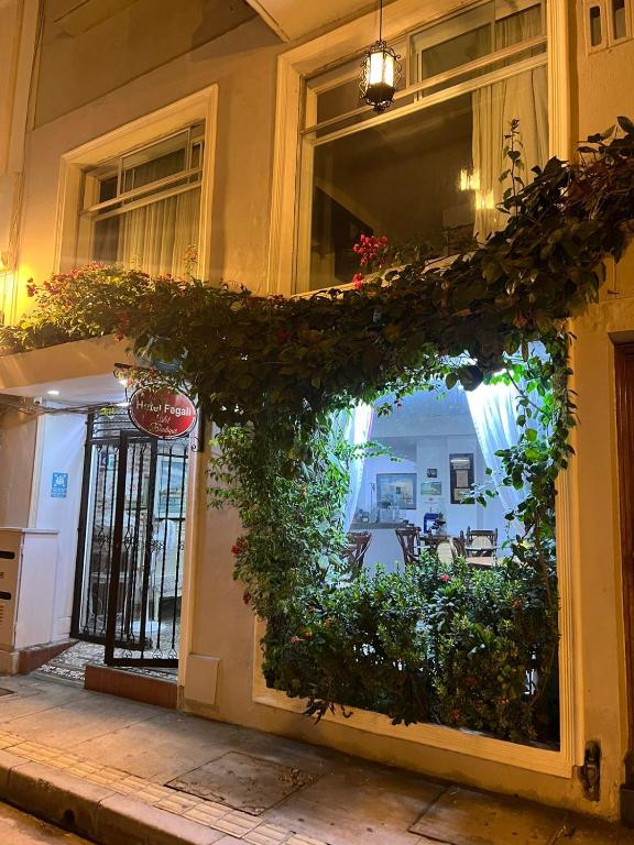 an entrance to a building with a bunch of plants at Hotel Fegali Art Boutique in Cartagena de Indias