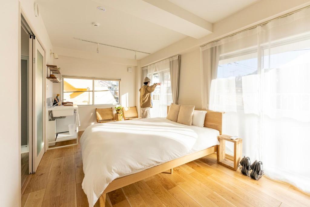 Postel nebo postele na pokoji v ubytování hotel & cafe ksnowki