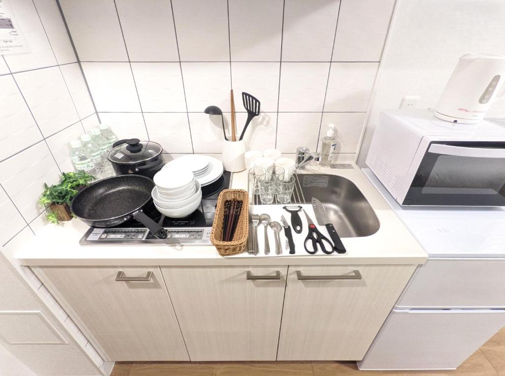 Kuchyň nebo kuchyňský kout v ubytování ESLEAD HOTEL Namba South Ⅰ