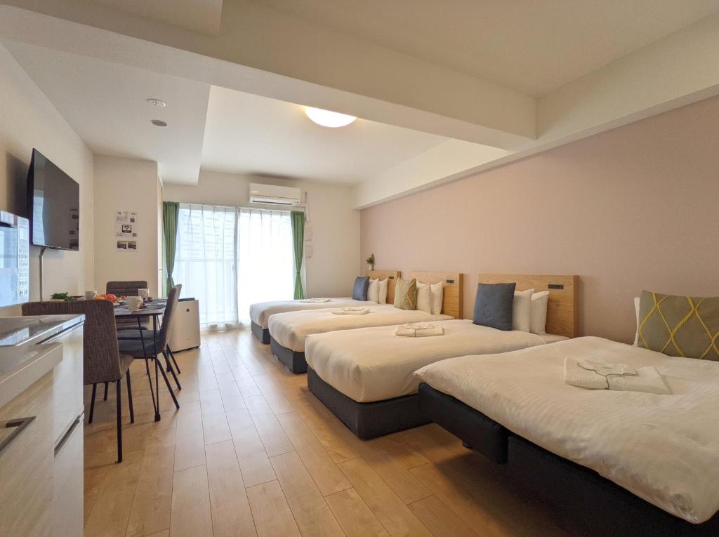 Postel nebo postele na pokoji v ubytování ESLEAD HOTEL Namba South Ⅰ