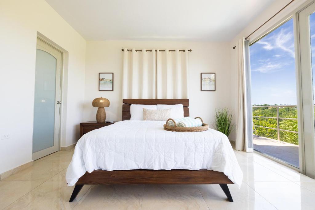 Postel nebo postele na pokoji v ubytování Rincon View Suites