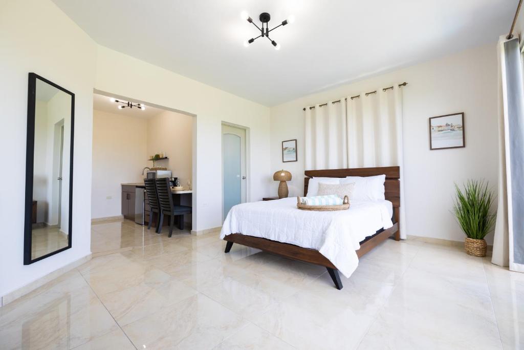 Postel nebo postele na pokoji v ubytování Rincon View Suites