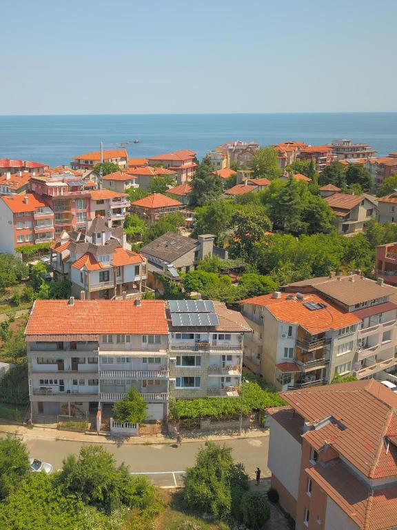 an aerial view of a city with houses and the ocean at Sarievi Holiday Home in Tsarevo
