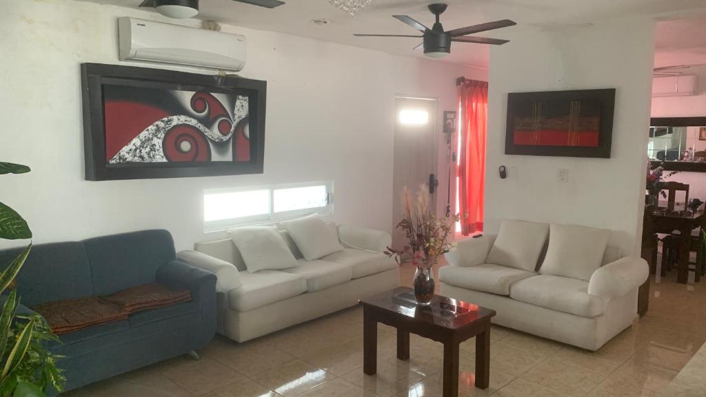 a living room with two couches and a table at Casa Intensamente in Jesús María
