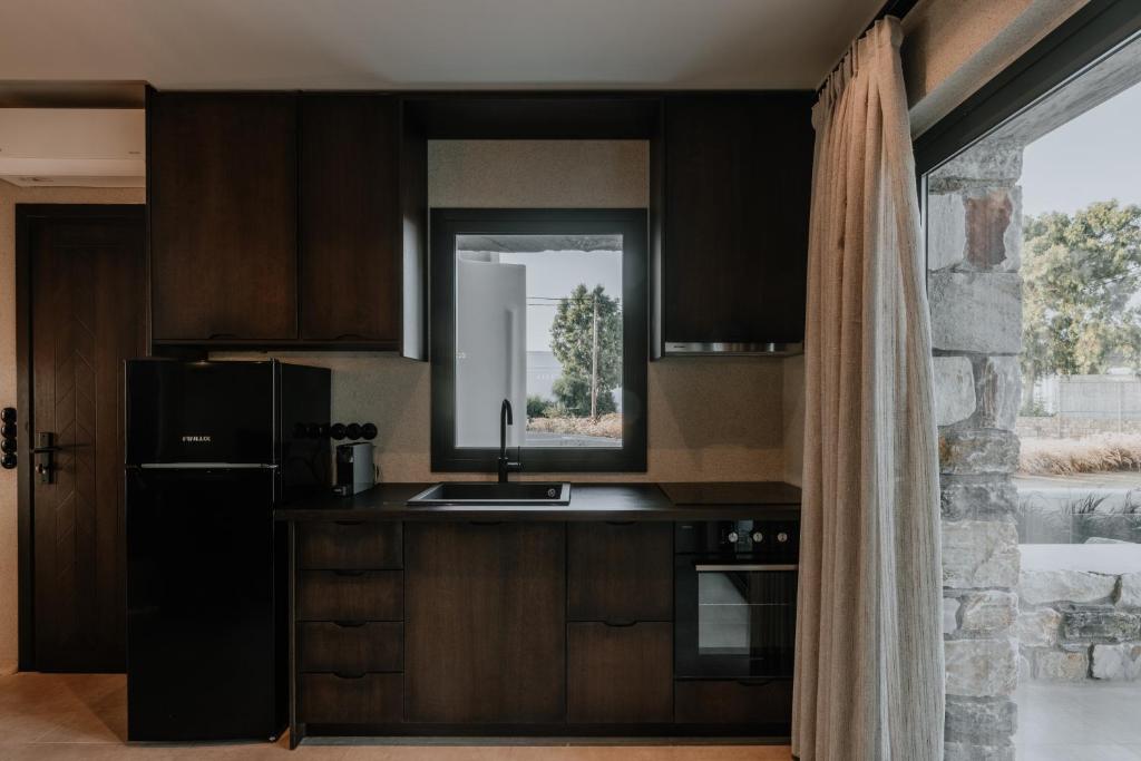 Kuchyň nebo kuchyňský kout v ubytování ONYM Curated Villas