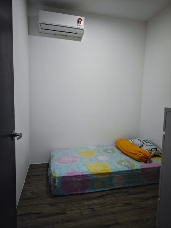 Postel nebo postele na pokoji v ubytování Aegean Homestay At The Podium