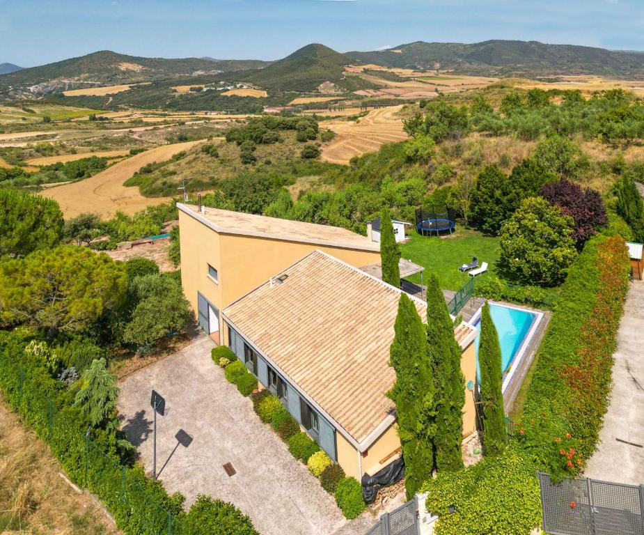 an aerial view of a house with a swimming pool at Casa Gazaga, amplia casa con piscina y jardín para toda la familia in Lácar