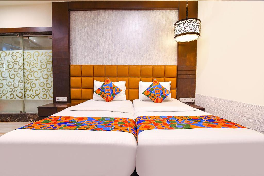 Postel nebo postele na pokoji v ubytování FabHotel Prime Goodwill