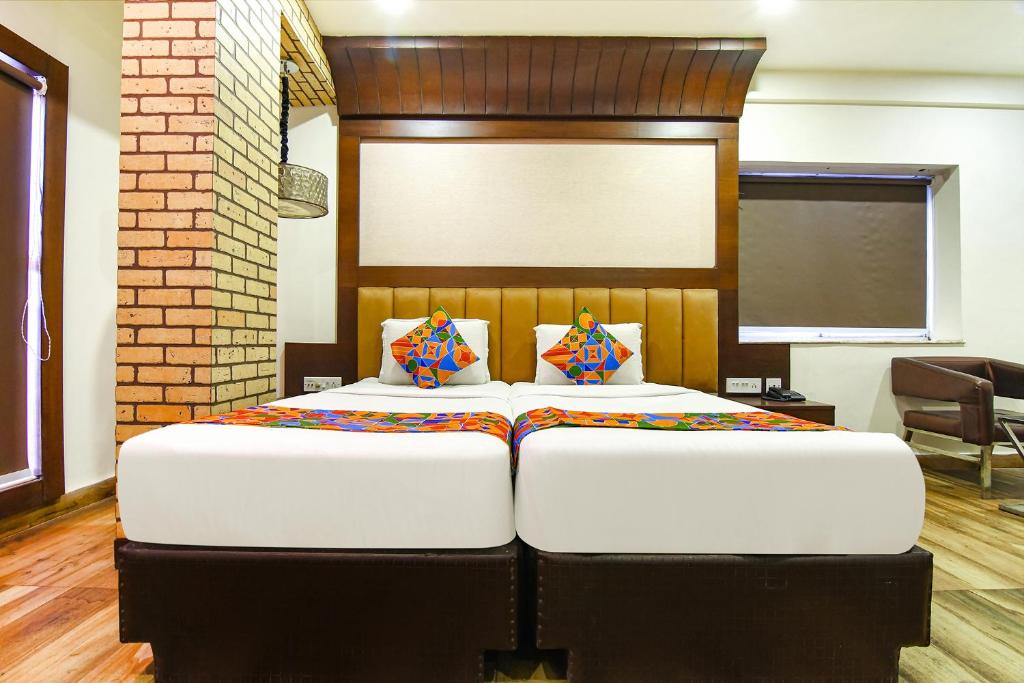 Postel nebo postele na pokoji v ubytování FabHotel Prime Goodwill