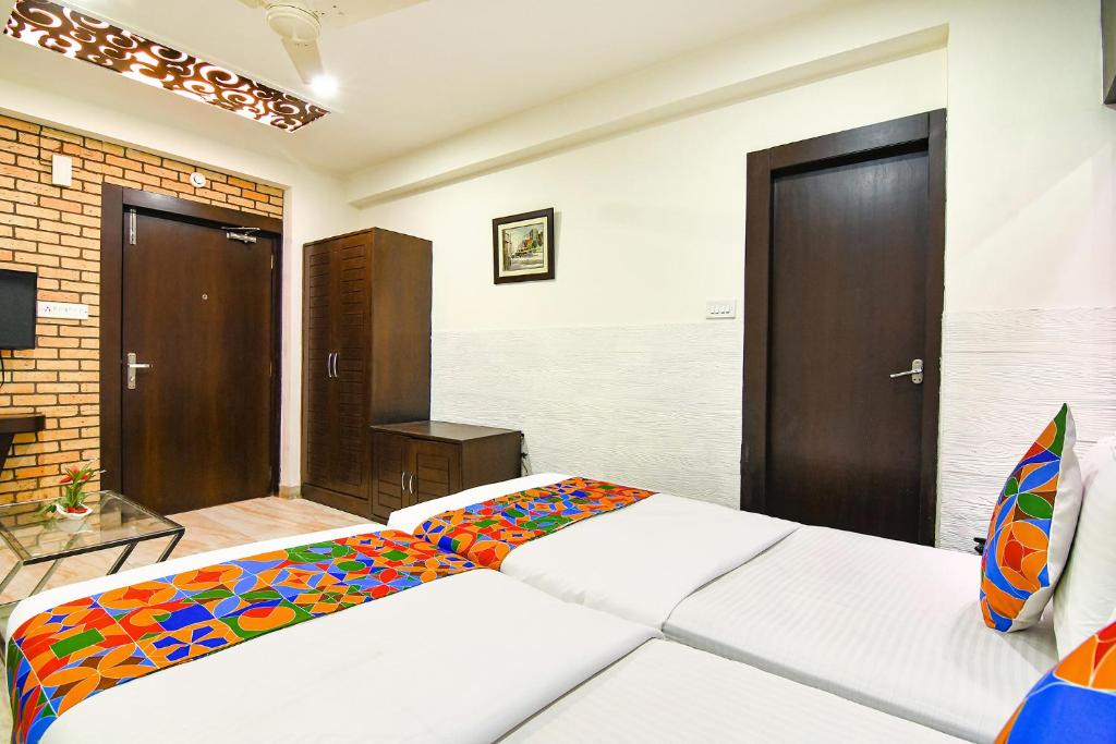 Postel nebo postele na pokoji v ubytování FabHotel Prime Goodwill