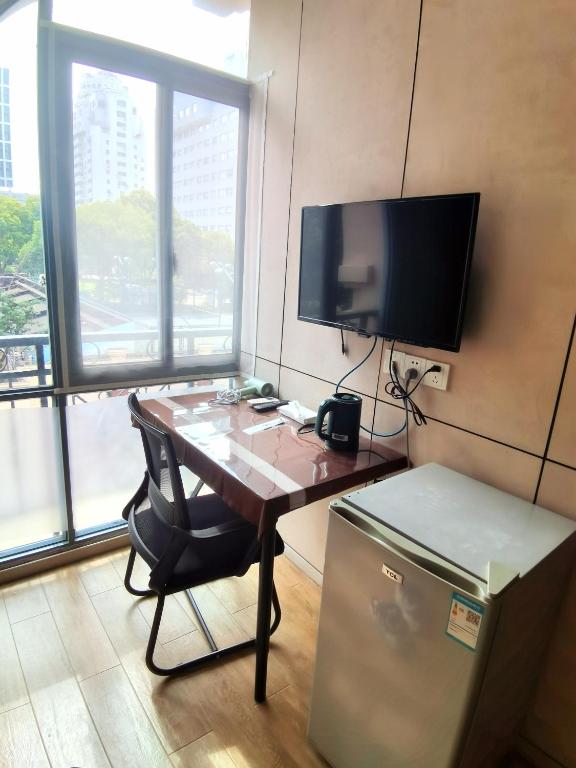 TV a/nebo společenská místnost v ubytování Yue Lv Hotel